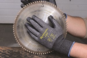 A zoomed in photo of a worker's foot showing work boots on a forklift